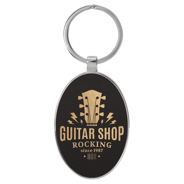 Black/Gold 3" x 1 3/4" Laserable Leatherette/Metal Oval Keychain